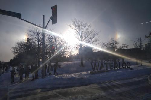 A pair of sundogs flank the morning sun over the University's south campus entrance.
