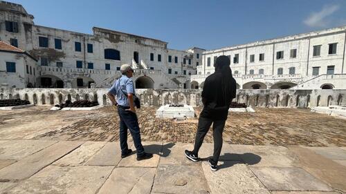 Vivek Goel and Christopher Taylor look at the inner courtyard of the Cape Coast Castle on the Gold Coast in Ghana.