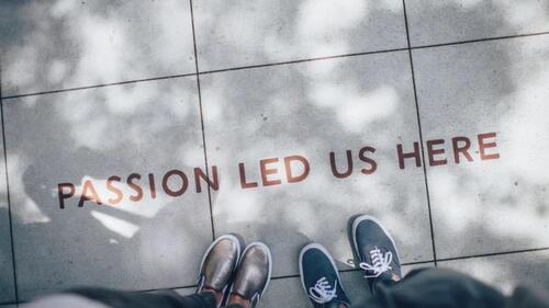 A tiled floor with the words &quot;passion led us here&quot; printed on them.