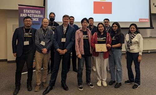 Sarah Wilson (fourth from right) and team members receiving the first-place award at Scotiabank Data Science Discovery Days.