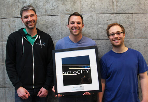 John Dick, Ryan Denomme, and Shawn Fitzpatrick with a Velocity framed picture.