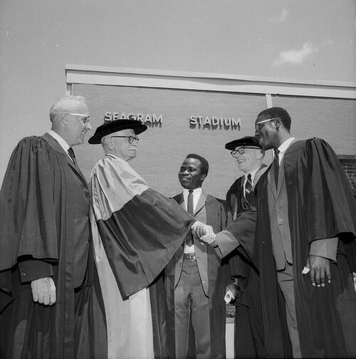 At the 1966 convocation (left to right) Douglas V. Gonder, honorary doctor of laws, Gen. A.G.L. McNaughton, honorary doctor of engineering,  Oluremi (O’Remi) Balogun, graduating engineer,  Dean Douglas Wright, and Chukuma Nwachuku, graduating engineer.