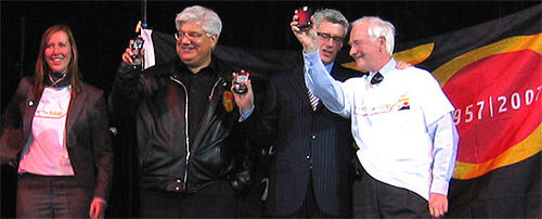 Feds President Michelle Zakrison, RIM Co-CEO (and University Chancellor) Mike Lazaridis, UWaterloo Board Chair Bob Harding, and President David Johnston hold up their BlackBerries at the kickoff to Waterloo's 50th anniversary celebrations in 2007.