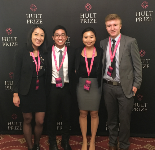 Members of Team EPOCH pose in front of a Hult Prize banner.