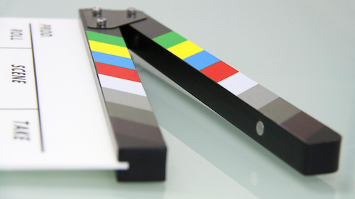 A film director's slate with a colour bar on the clapper.