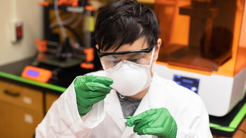 Research professor Chau-Min Phan works in a laboratory.