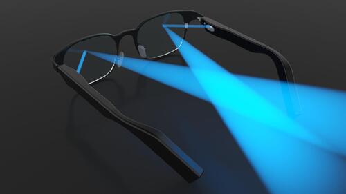 A pair of glasses with blue beams of light refracting.