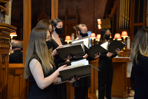 Members of the Chamber Choir sing on stage.