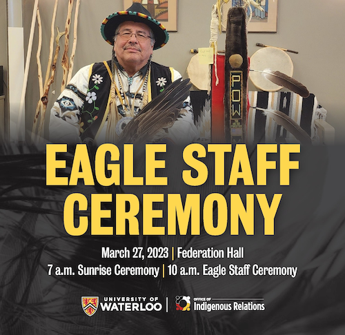 Indigenous Knowledge Keeper Myeengun Henry holds an eagle feather.