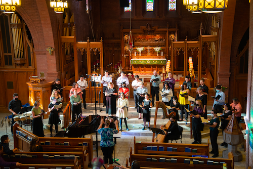 The University Choir sings in a church.