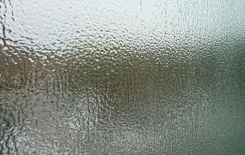 A coating of ice obscures a window on the University campus.