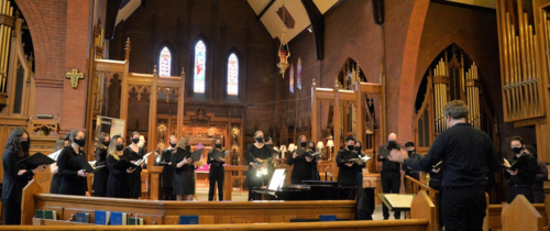 The Chamber Choir performs in a church sanctuary.