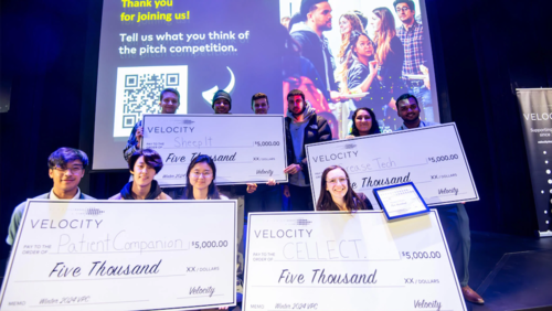 Velocity pitch competition winners with their oversized cheques.