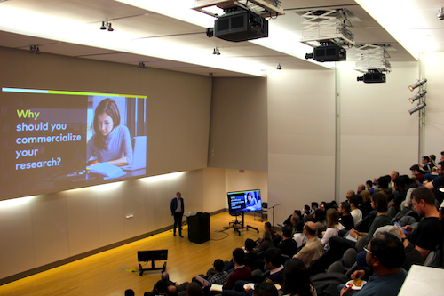 An Up Start presentation taking place in a lecture hall.