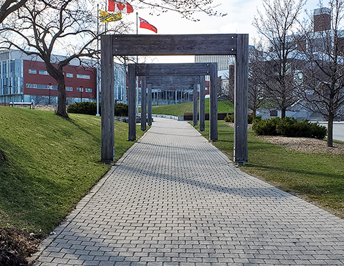 The University's south campus gateway arches, devoid of human traffic.