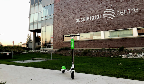 A Lime eScooter parked in front of the Accelerator Centre.