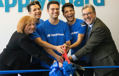 Feridun Hamdullahpur cuts the ribbon at the ApplyBoard HQ grand opening with the co-founders.