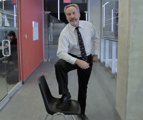 Dave McDougall puts his foot up on a chair as his signature move in a Feds election video from 2012.