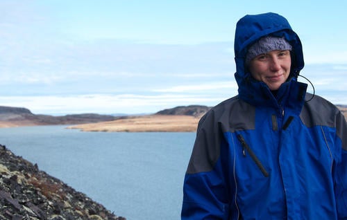 Researcher Heidi Swanson beside a lake in Nunavat.