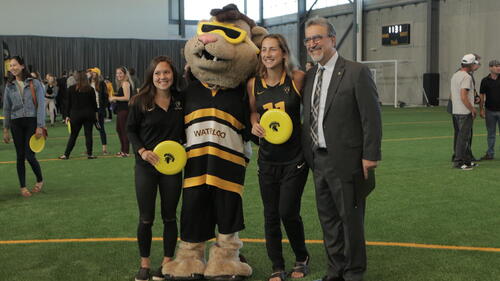 Feridun Hamdullahpur, King Warrior and student-athletes at the opening of the Field House.