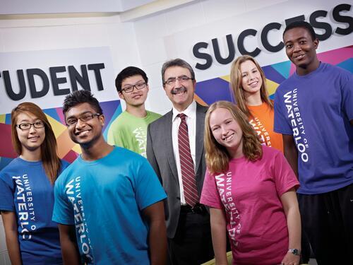 President Feridun Hamdullaphur poses with students from different faculties at the opening of the Student Success Office in 2011.