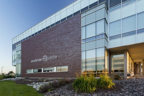 The front of the Accelerator Centre building, displaying its logo.