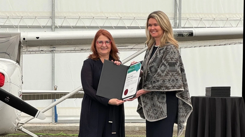 Dr. Nancy Waite holds her award citation with Minister Jill Dunlop.