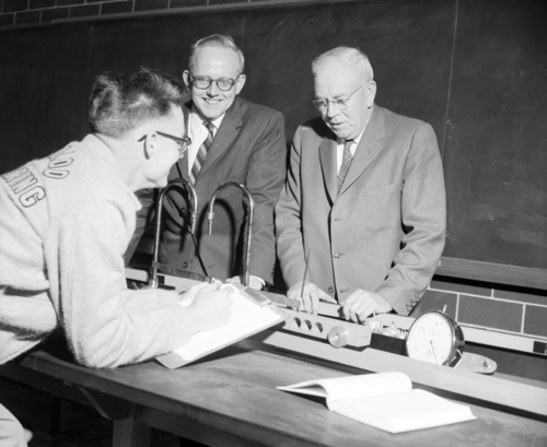 Dean Douglas Wright with an engineering student and JJ Hanna of the Institute of Engineering Canada at the opening of the Physics building in 1959.
