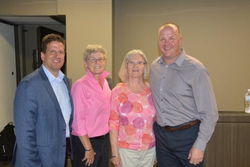  Ingrid Schugard (2nd from the right) with two of the former Director of Athletics (Bob Copeland, Judy McCrae) and current AD Roly Webster (far right)