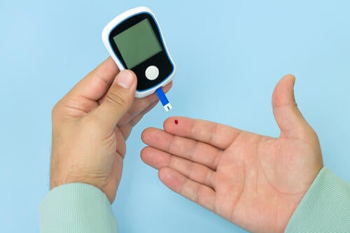 A finger prick diabetes blood test