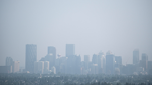 A Canadian city's skyline choked with haze and smoke from wildfires.