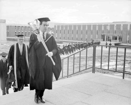 Ron Eydt carries the mace (with Chancellor Dana Porter walking behind) on October 23, 1965.
