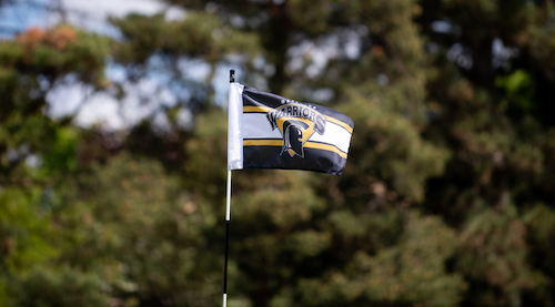 A Waterloo Warriors golf flag on the course.