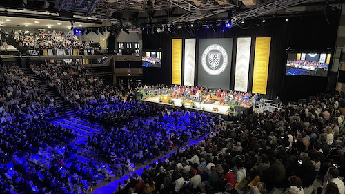 The Convocation stage and assembled crowd in the main gym of the PAC.