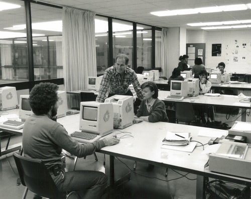 Arnie Dyck in a computer lab with students circa 1986.