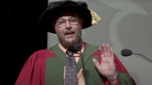 Scott Leatherdale, dressed in Convocation regalia, speaks at the Faculty of Health convocation ceremony.