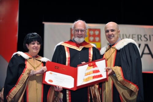 Professor Francois Pare receives an honorary doctorate at Laval.