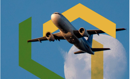 An airplane piercing a blue sky with green and yellow chevron details.