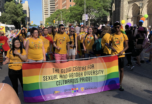 The University of Waterloo contingent with their rainbow banner at the Toronto Pride Parade.