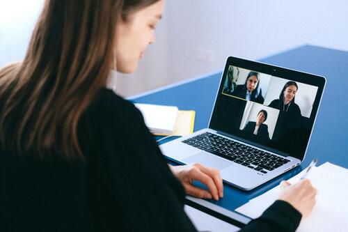 A group of people in an online meeting.