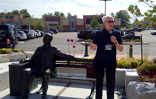 University Historian Ken McLaughlin speaks at the unveiling of Ira Needles' statue at the Boardwalk.