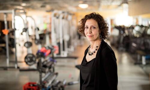 Professor Marina Mourtzakis stands in a fitness centre.