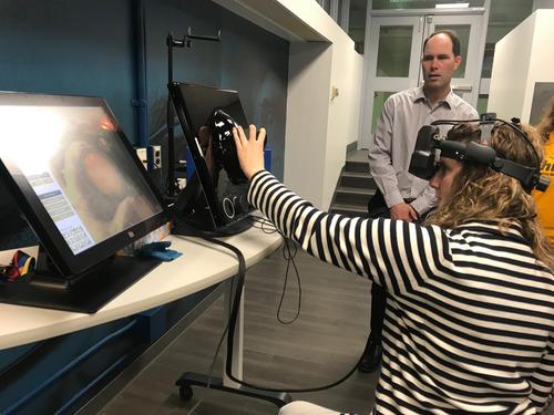 A person uses a VR headset.