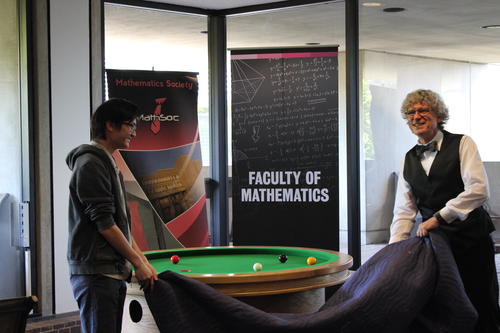 MathSoc president Jason P’Ng and Dean of the Faculty of Mathematics Stephen M. Watt unveil North America’s first elliptical pool table.