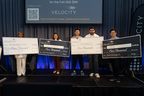 The Concept $5K winners stand with their oversized cheques.