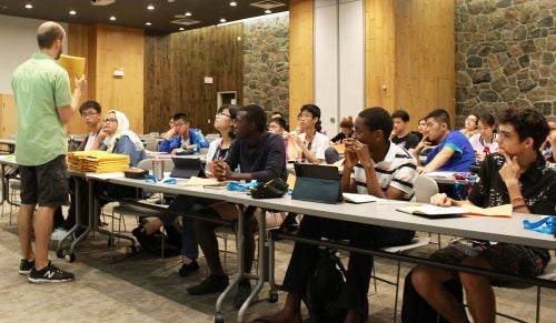 Students listen to a speaker during an IDEAS Summer Experience session.