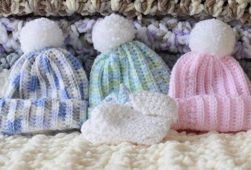 Colourful hand-knitted hats for babies