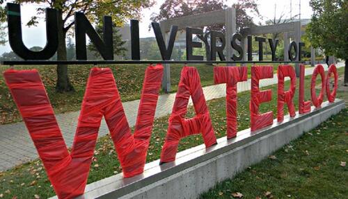 The South Campus University of Waterloo sign wrapped in red.