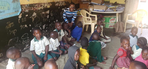 Darren Harry Baine with children in Uganda.