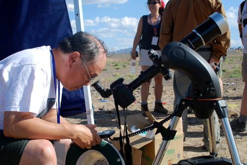 Professor Ralph Chou views an eclipse in 2008 with proper equipment.